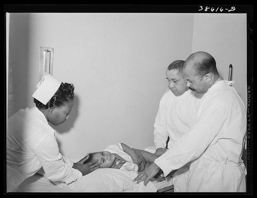 Examining baby at clinic of Negro hospital. Chicago, Illinois