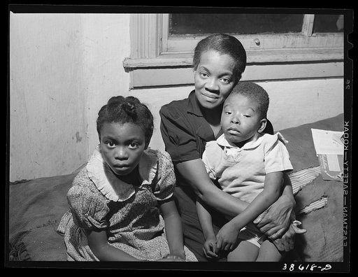 Mother and two children. Family is on relief. Chicago, Illinois