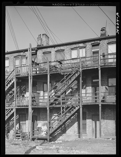 Untitled photo, possibly related to: Back of apartment house rented to Negroes. Southside of Chicago, Illinois