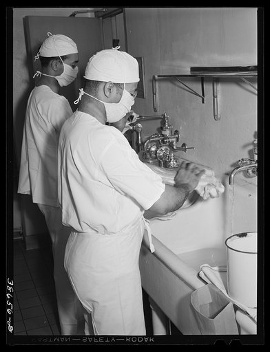 Doctors scrubbing up before operation. Negro hospital, Chicago, Illinois