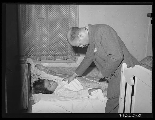 Untitled photo, possibly related to: Doctor examining patient in her home. Family is on relief. Chicago, Illinois