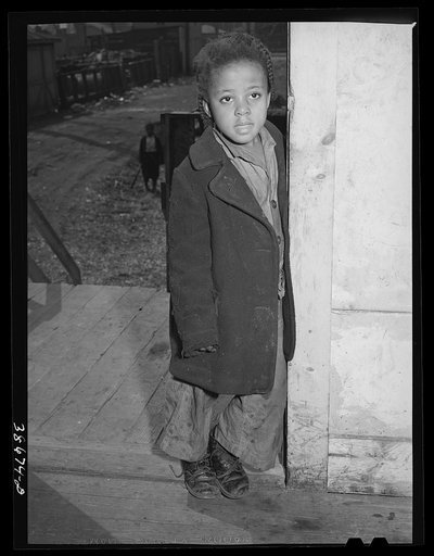 Negro girl standing in doorway. Family is on relief. Chicago, Illinois