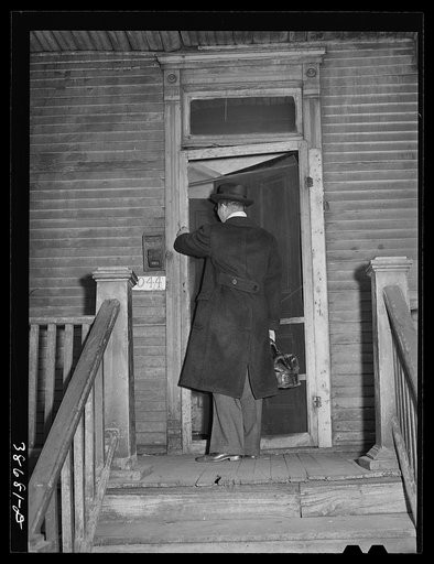 Doctor entering home of relief family. Chicago, Illinois