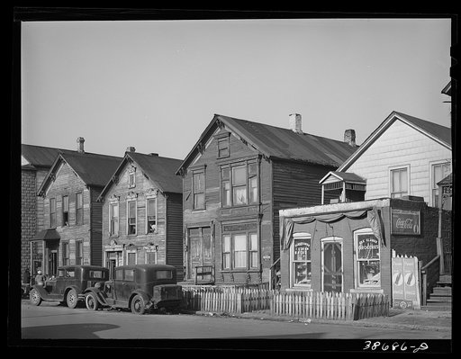 Houses and grocery store on Federal Street in the Negro section of Chicago, Illinois