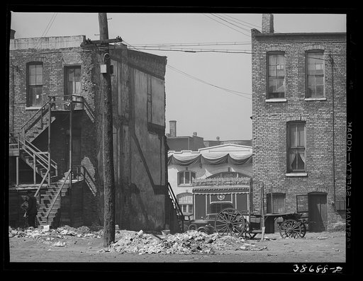 Untitled photo, possibly related to: Apartment houses and funeral parlor in Negro section of Chicago, Illinois