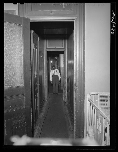 Untitled photo, possibly related to: Hall leading to apartment of Negro railroad worker. Chicago, Illinois
