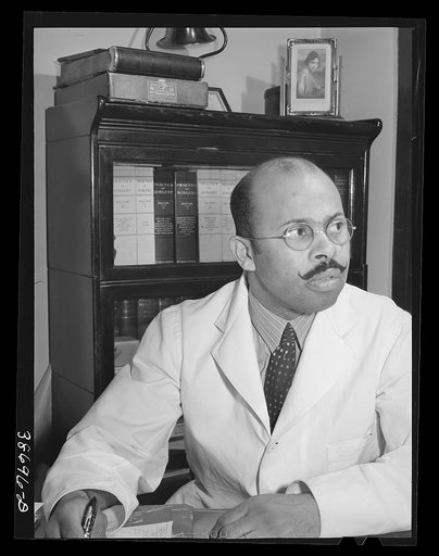 Doctor in his office. Chicago, Illinois