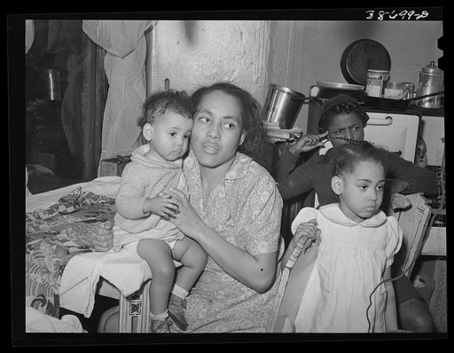 Mother and children at home. Chicago, Illinois