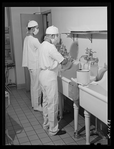 Doctors at hospital scrubbing up. Chicago, Illinois