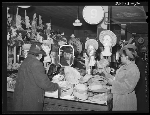 Buying hats in ten-cent store which caters to Negroes. Chicago, Illinois