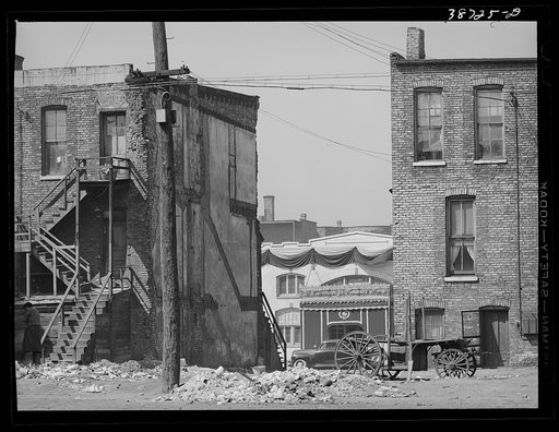 Untitled photo, possibly related to: Apartment houses and funeral parlor in Negro section of Chicago, Illinois
