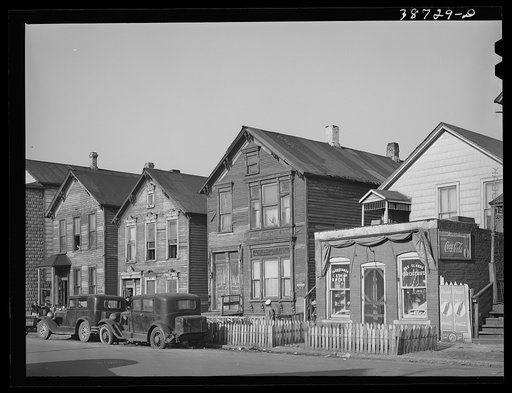 Untitled photo, possibly related to: Houses and grocery store on Federal Street in the Negro section of Chicago, Illiniois