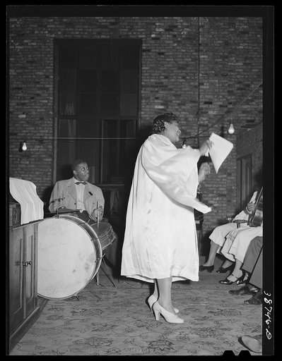 One of the leaders at the Pentecostal church directing the singing, Chicago, Illinois