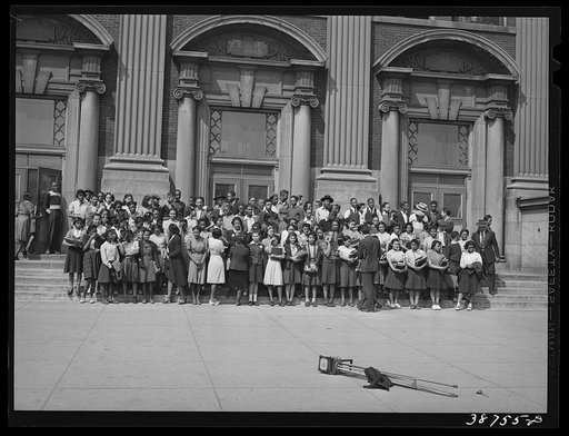 Children at high school being posed for photograph. Southside of Chicago, Illinois