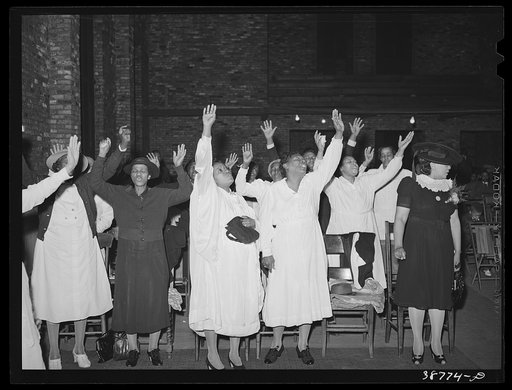Members of the Pentecostal church praising the Lord. Chicago, Illinois