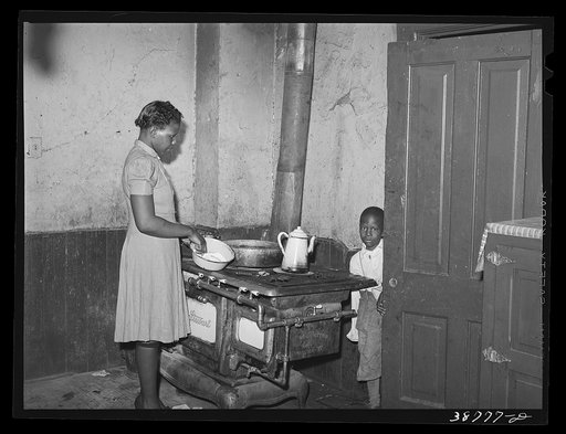 Corner of kitchen of apartment rented to Negroes. Chicago, Illinois