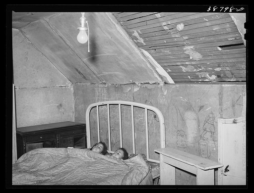 Upstairs bedroom of family on relief. Chicago, Illinois