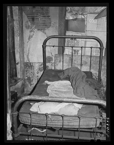 Room in rooming house for Negroes. Chicago, Illinois
