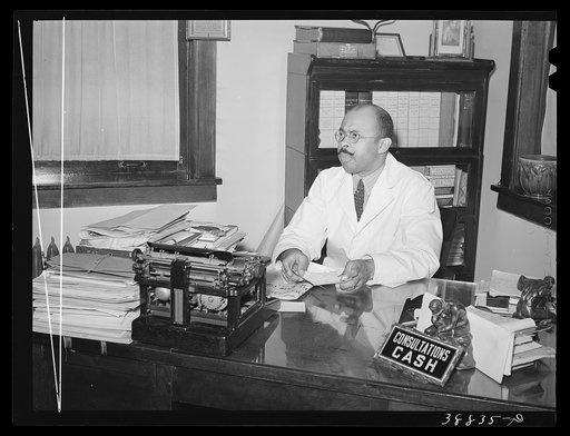 Doctor in his office. Southside of Chicago, Illinois