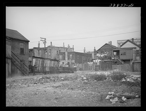 Vacant lot and backs of apartment buildings. Southside of Chicago, Illinois
