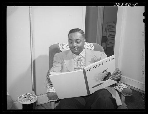 The best dressed Negro in Chicago, Illinois, spends an evening reading
