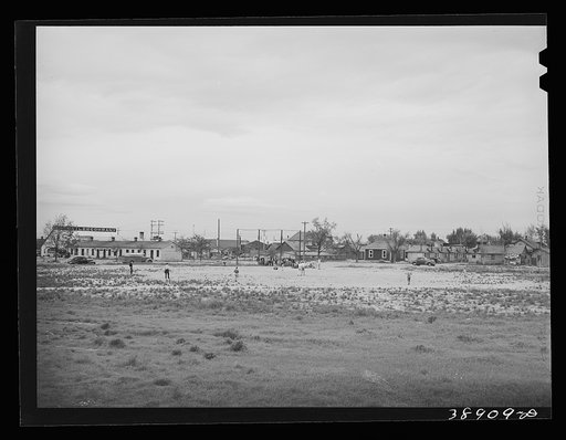 Untitled photo, possibly related to: Sandlot baseball game. Twin Falls, Idaho. Twin Falls was settled mostly by people from the middle west when water for irrigation was made available to the section. Twin Falls, Idaho