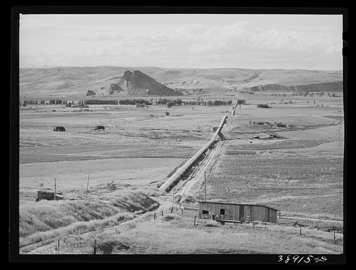 Conduit carrying irrigation water across the Owyhee River Valley to Dead Ox Flat. Vale-Owyhee irrigation project. Malheur County, Oregon