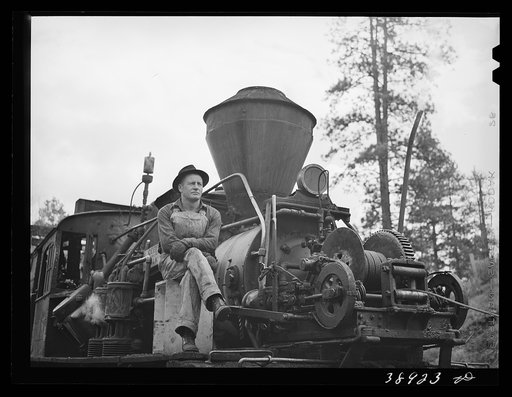 Untitled photo, possibly related to: Logging locomotive and operator. Baker County, Oregon