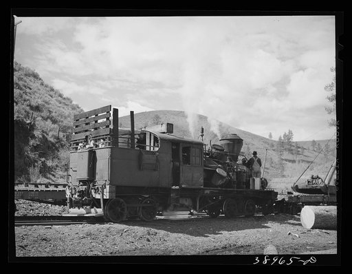 Locomotive of logging train. Baker County, Oregon. There has been a tendency to change from the logging train to trucks to transport logs to mills during recent years