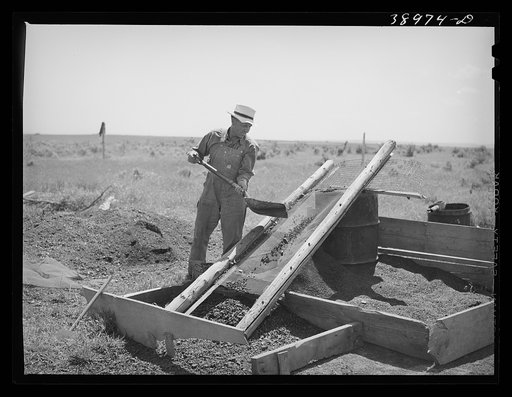 Mrs. Browning and her daughter eating dinner. This family does much canning in line with FSA (Farm Security Administration) live at home program. They are FSA rehabilitation borrowers at Dead Ox Flat, Malheur County, Oregon