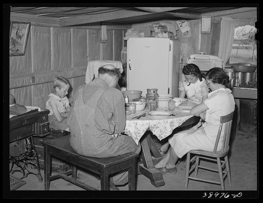 The Browning family says grace before dinner. Mr. Browning is a  FSA  (Farm Security Administration) rehabilitation borrower living at Dead Ox Flat, Malheur County, Oregon