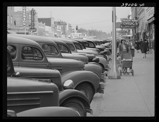 Main street of Twin Falls, Idaho. According to Idaho State Guide (Federal Writers Project), this town had the distinction, unusual in towns in the section, of being planned