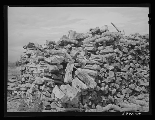 Pile of wood on farm of Mr. Free, FSA (Farm Security Administration) rehabilitation borrower. Dead Ox Flat, Malheur County, Oregon
