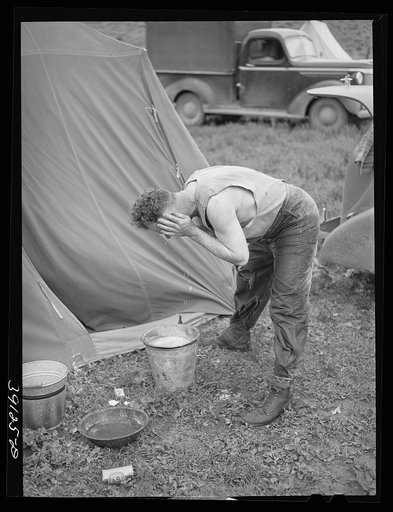 Sheep shearer washes up for dinner. Ranch in Malheur County, Oregon
