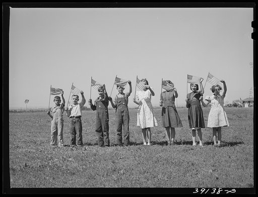 Flag drill for entertainment at end of school term at the FSA (Farm Security Administration) camp for farm workers. Caldwell, Idaho