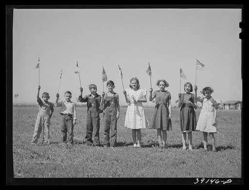 Untitled photo, possibly related to: Flag drill for entertainment at end of school term at the FSA (Farm Security Administration) camp for farm workers. Caldwell, Idaho