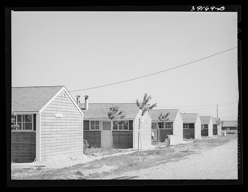 Untitled photo, possibly related to: Row shelters at the FSA (Farm Security Administration) farm workers' camp. Caldwell, Idaho