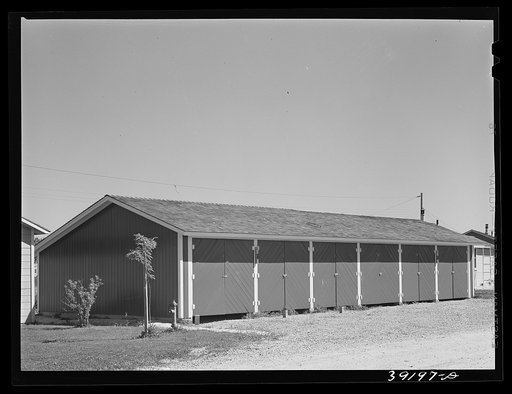 Garages for permanent farm workers at the FSA (Farm Security Administration) farm workers' camp. Caldwell, Idaho