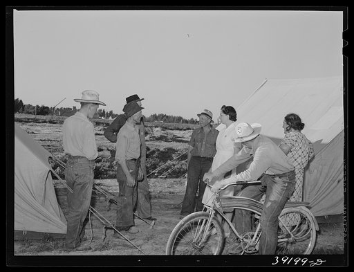 Nurse with group of farm workers as she makes her calls in the afternoon. FSA (Farm Security Administration) migratory labor camp mobile unit. Wilder, Idaho