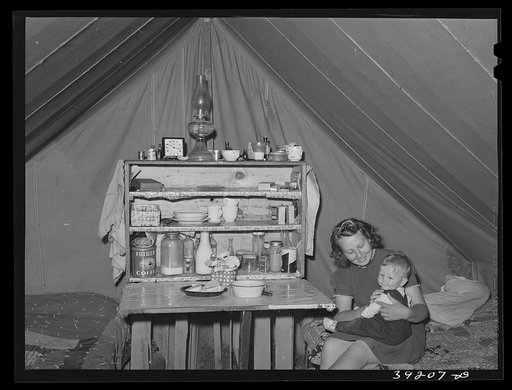 Mother and child at the FSA (Farm Security Administration) migratory labor camp mobile unit. Wilder, Idaho