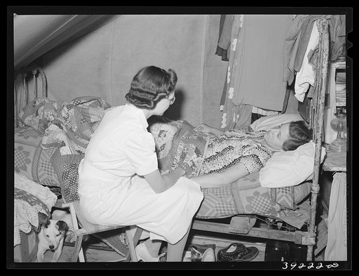 The nurse visits farm worker who is sick. FSA (Farm Security Administration) migratory labor camp mobile unit. Wilder, Idaho