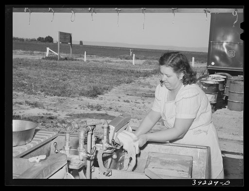 Laundry at the FSA (Farm Security Administration) migratory labor camp mobile unit. Wilder, Idaho. Power for the entire camp is furnished by a portable generator unit