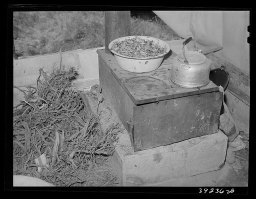 Untitled photo, possibly related to: Cook stove in tent home of young farmer and his wife. Vale-Owyhee irrigation project, Malheur County, Oregon. This is first year on this land, in fact, they had been here only two months. This year they will devote time, energy, and money to getting their land in