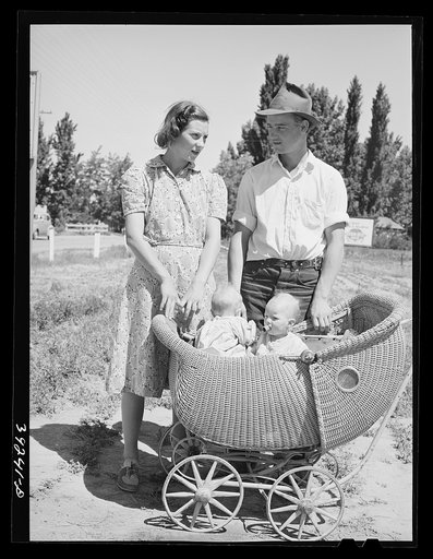 Untitled photo, possibly related to: Farm worker with his wife and their twin babies at the FSA (Farm Security Administration) migratory labor camp mobile unit. Wilder, Idaho