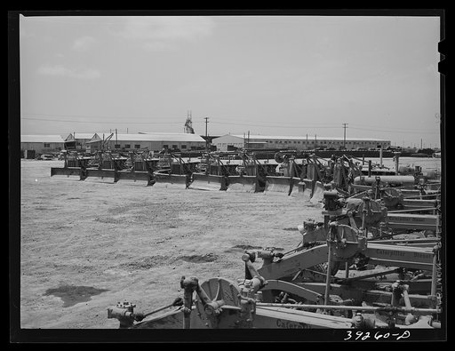 Untitled photo, possibly related to: Road scraper with houses under construction at the Kearney-Mesa defense housing project. San Diego, California