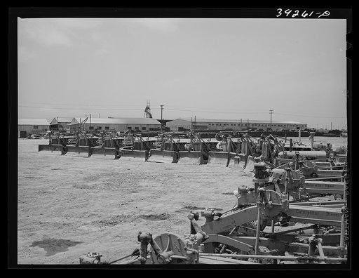 Road scraper with houses under construction at the Kearney-Mesa defense housing project. San Diego, California
