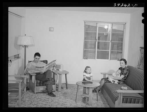 Family group of family living in house at Kearney Mesa defense housing project. This man came out to California from Oklahoma ten years ago. He has been an agricultural worker and has lived in various FSA (Farm Security Administration camps). He is now employed as a painter at the Consolidated Aircr