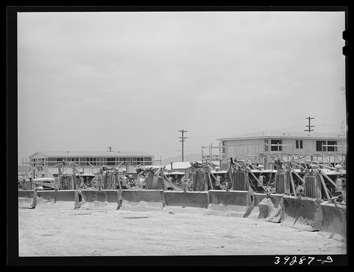 Bulldozers with houses under construction at Kearney-Mesa. This is a defense housing project of the Public Buildings Administration by the Federal Works Agency