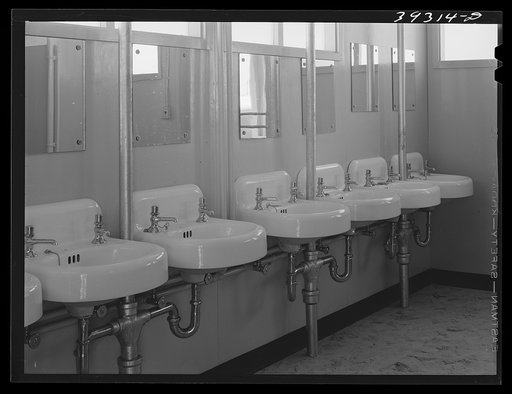 Washbasins at the FSA (Farm Security Administration) trailer camp for defense workers. San Diego, California