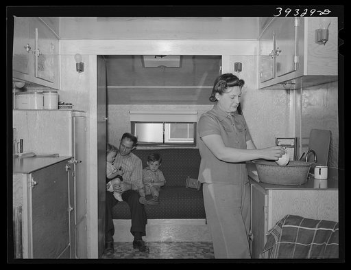 Family group at home at the FSA (Farm Security Administration) camp for defense workers. San Diego, California